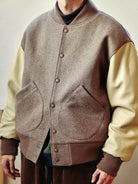 USAGE Reversible Velvet Leather Varsity Jacket in Beige - On Male Model