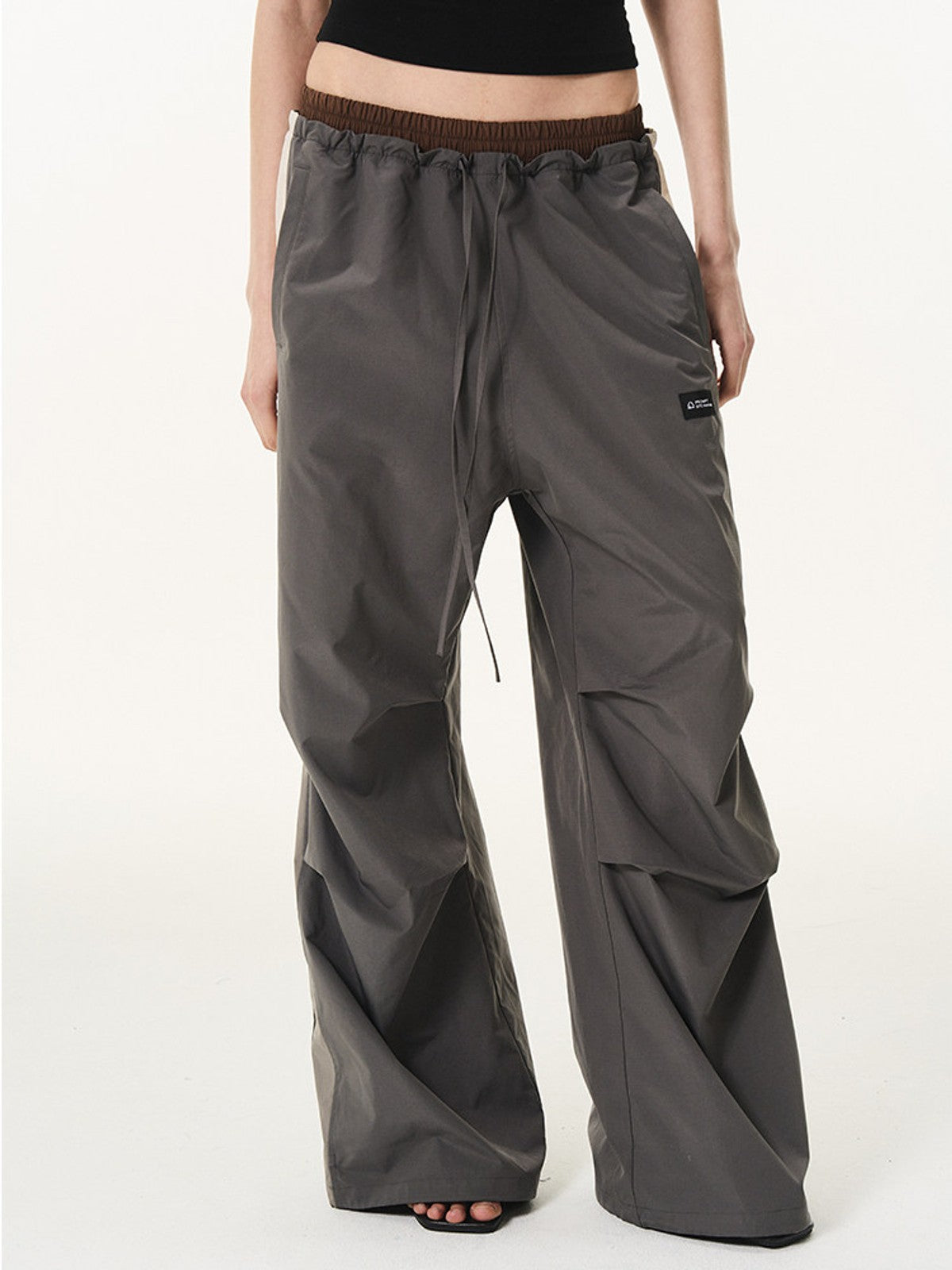 BLINDNOPLAN Contrast Panel Pleated Parachute Pants in Gray - On Female Model