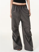 BLINDNOPLAN Contrast Panel Pleated Parachute Pants in Gray - On Female Model