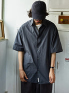 USAGE Cotton Crinkle Short Sleeve Shirt in Navy Blue - On Male Model