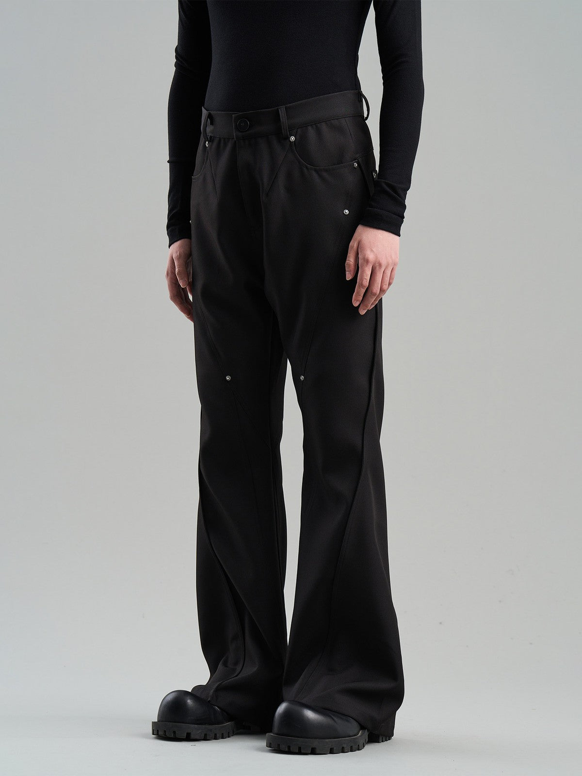 BLINDNOPLAN Diagonal Paneled Trousers with Rivets in Black - On Model