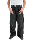UNKNOWNWORLD Distressed Boro Mud Dyed Jeans in Black - On Male Model