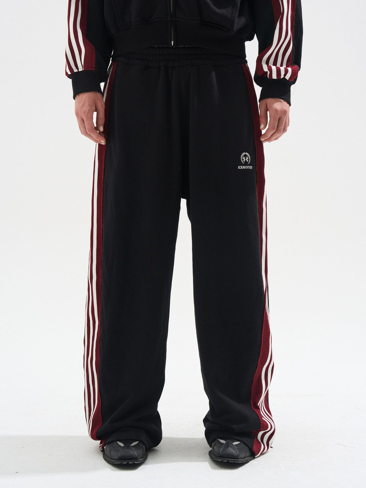 BLINDNOPLAN Raw Edge Contrast Paneled Sweatpants in Black - On Model