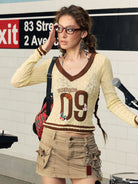 BEERBRO Puppy Patch Sheer Knit V Neck in Cream - On Female Model