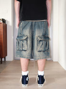 UNKNOWNWORLD Mud Dyed Multi Pocket Denim Shorts in Blue - On Model