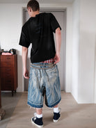UNKNOWNWORLD Distressed Wash Baggy Shorts in Blue - On Male Model