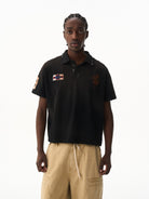 BLINDNOPLAN Distressed Embroidered Cotton Polo in Black - On Male Model