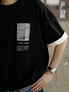 USAGE Air Spun Cotton Graphic T Shirt in Black - On Male Model