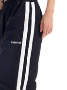 BLINDNOPLAN Striped Pleated Track Pants in Black - On Female Model