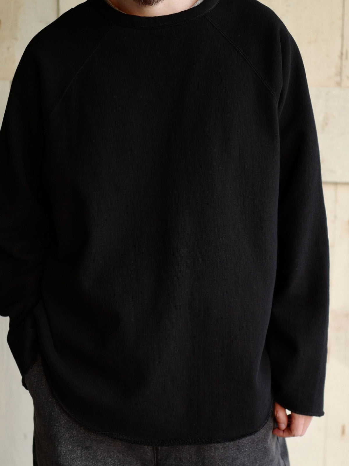 USAGE Slub Cotton Raglan Sweatshirt in Black - On Male Model