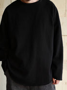 USAGE Slub Cotton Raglan Sweatshirt in Black - On Male Model