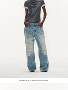 BLINDNOPLAN Paneled Embroidered Distressed Denim Pants in Blue - On Female Model