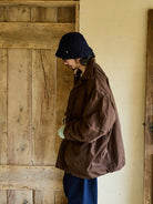 USAGE Washed Cotton Twill M65 Jacket in Brown - On Male Model