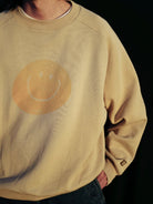 USAGE Washed Cotton Raglan Smiley Sweatshirt in Beige - On Male Model