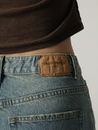 MASONPRINCE High Waisted Distressed Flared Jeans in Navy Blue - On Model