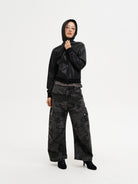 MASONPRINCE Curved Leg Camouflage Cargo Pants in Black - On Female Model