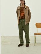 USAGE Heavyweight Herringbone Twill Belted Trousers in Olive - On Male Model