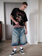UNKNOWNWORLD Distressed Wash Baggy Shorts in Blue - On Male Model