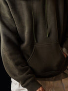USAGE Faded Vintage Wash Hoodie in Olive - On Male Model
