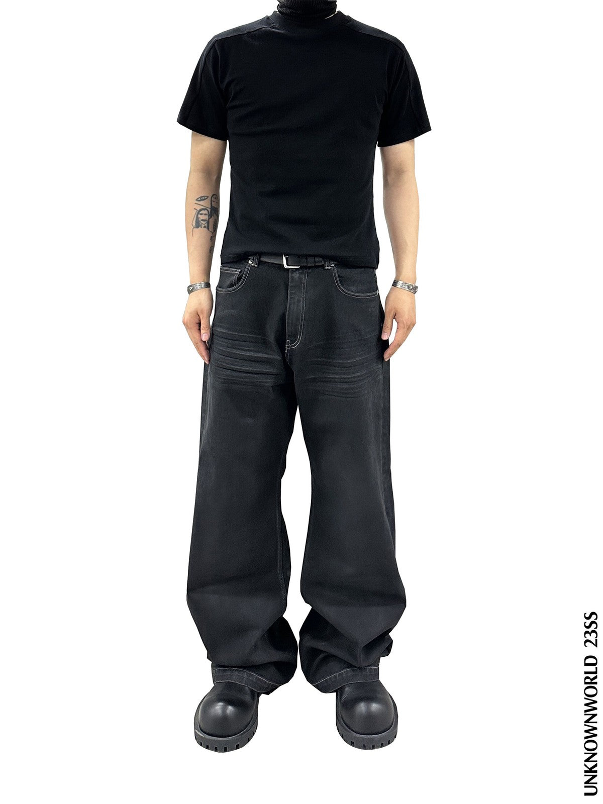 UNKNOWNWORLD Washed Waxed Wide Leg Jeans in Black - On Model