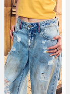 BeerBro Distressed Dirty Wash Relaxed Jeans in Blue - On Female Model