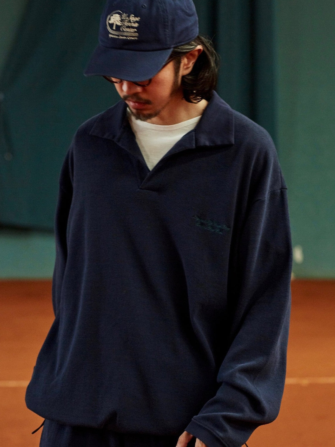 USAGE Oversized Textured Long Sleeve Polo in Navy Blue - On Male Model