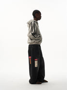 BLINDNOPLAN Distressed Embroidered Zip Up Hoodie in Gray - On Male Model