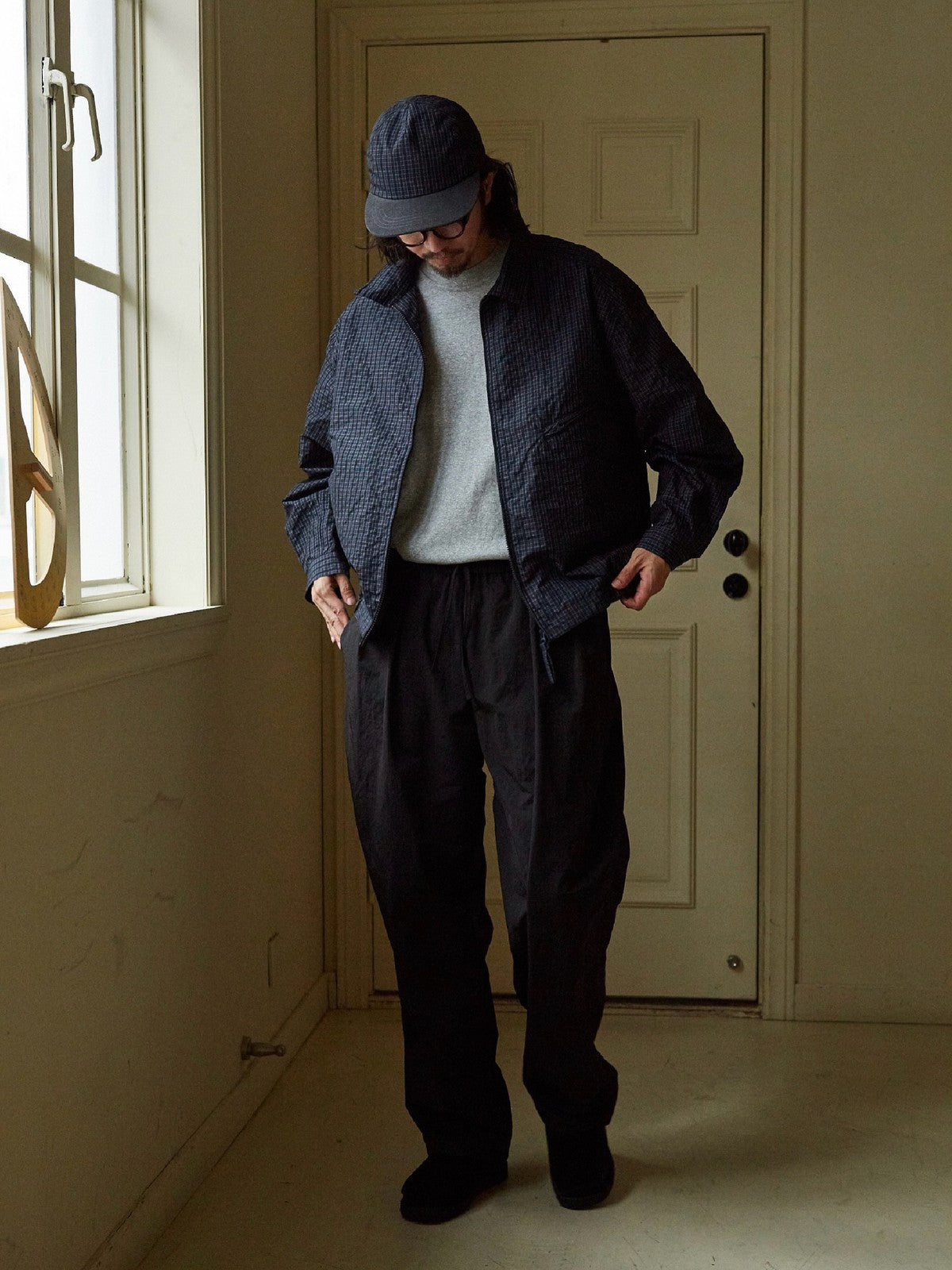 USAGE Jacquard Check Harrington Jacket in Navy Blue - On Male Model