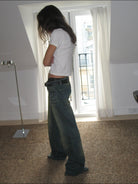 FaxCopyExpress Curved Panel Dirty Wash Jeans in Denim - On Female Model