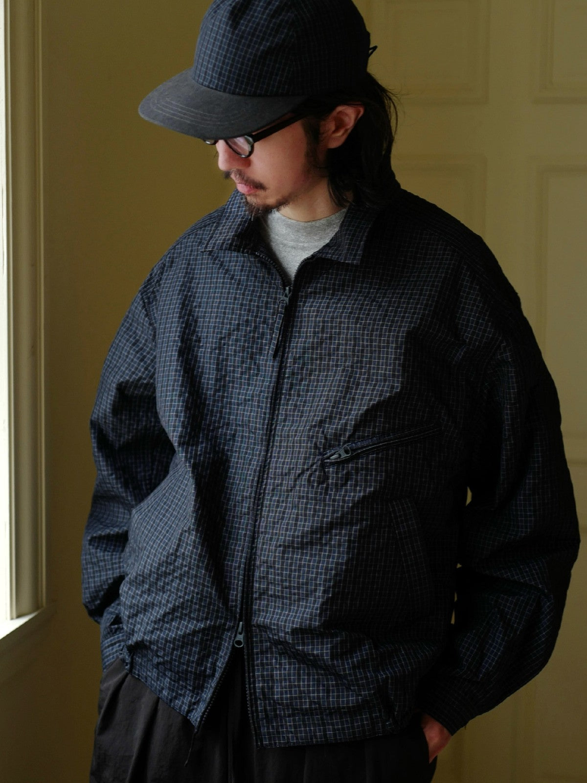 USAGE Jacquard Check Harrington Jacket in Navy Blue - On Male Model