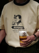 USAGE Graphic Cotton Ringer T Shirt in Cream - On Male Model