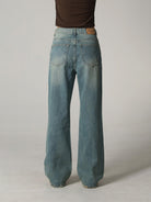 MASONPRINCE High Waisted Distressed Flared Jeans in Navy Blue - On Model