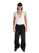 UNKNOWNWORLD Distressed Boro Mud Dyed Jeans in Black - On Male Model