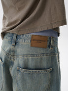 MASONPRINCE Frayed Hem Slub Denim Pants in Light Blue - On Model