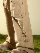BEERBRO Washed Buckle Strap Cargo Pants in Beige - On Female Model