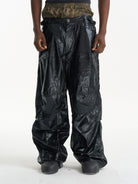 BLINDNOPLAN Faux Leather Layered Cargo Pants in Black - On Male Model