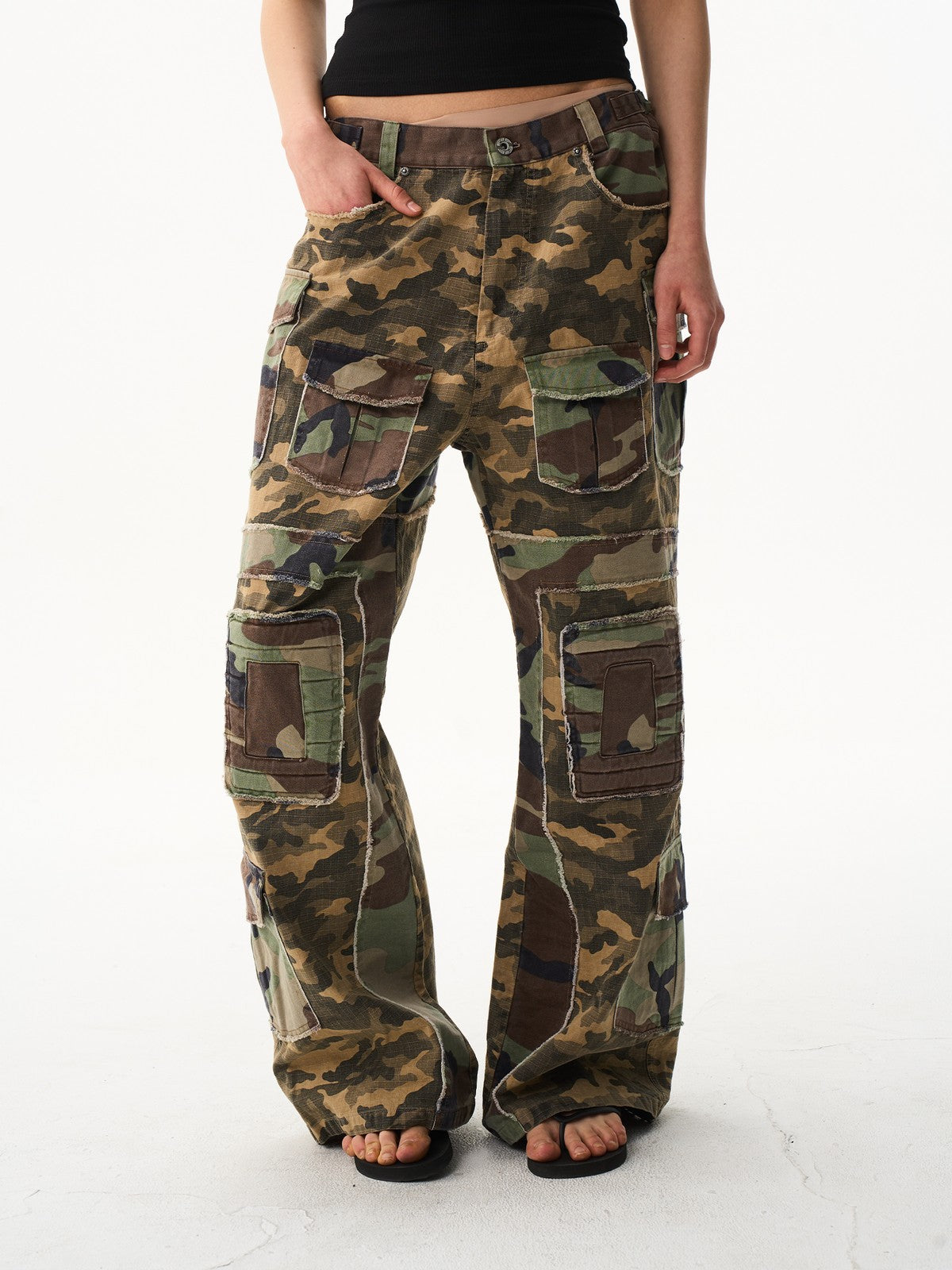 BLINDNOPLAN Paneled Camo Flared Cargo Pants in Green - On Model