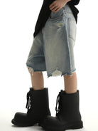 MASONPRINCE Light Wash Raw Hem Denim Shorts in Blue - On Model