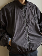 USAGE Lightweight Nylon Zip Up Jacket in Gray - On Male Model