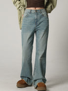 MASONPRINCE High Waisted Distressed Flared Jeans in Denim - On Female Model