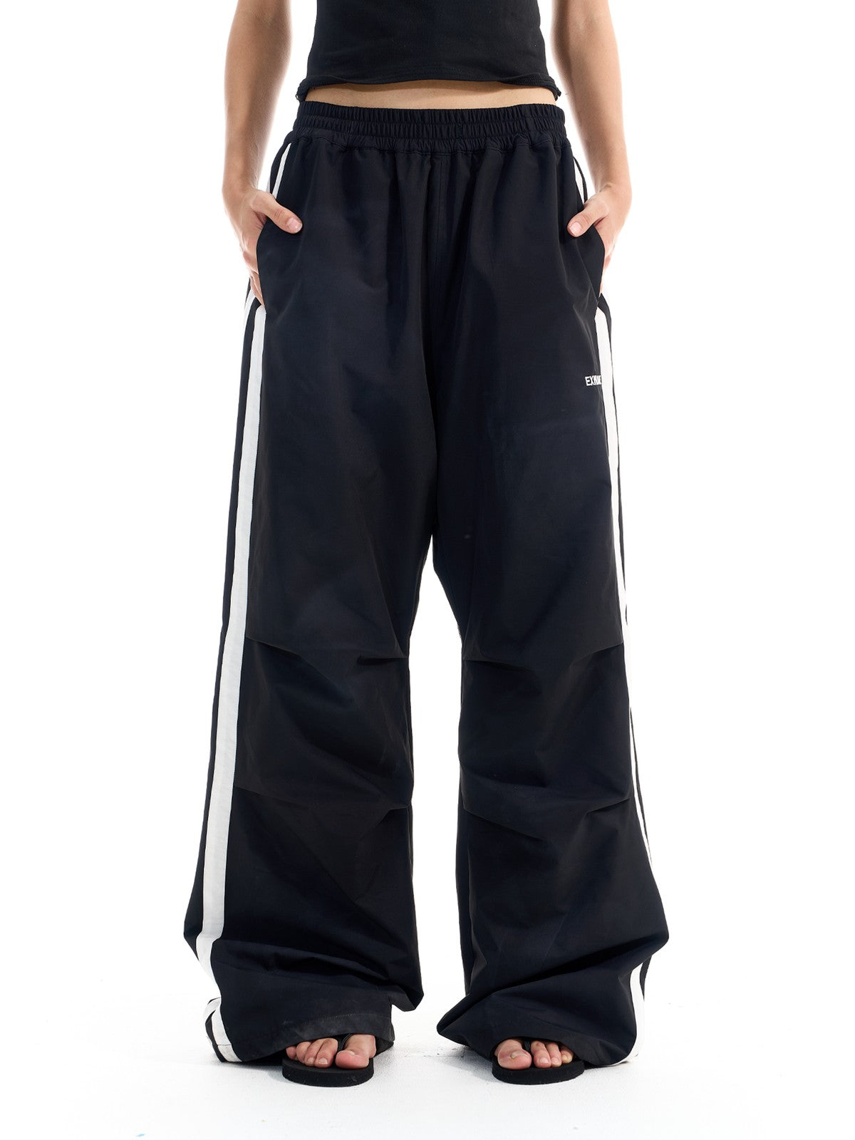 BLINDNOPLAN Striped Pleated Track Pants in Black - On Female Model