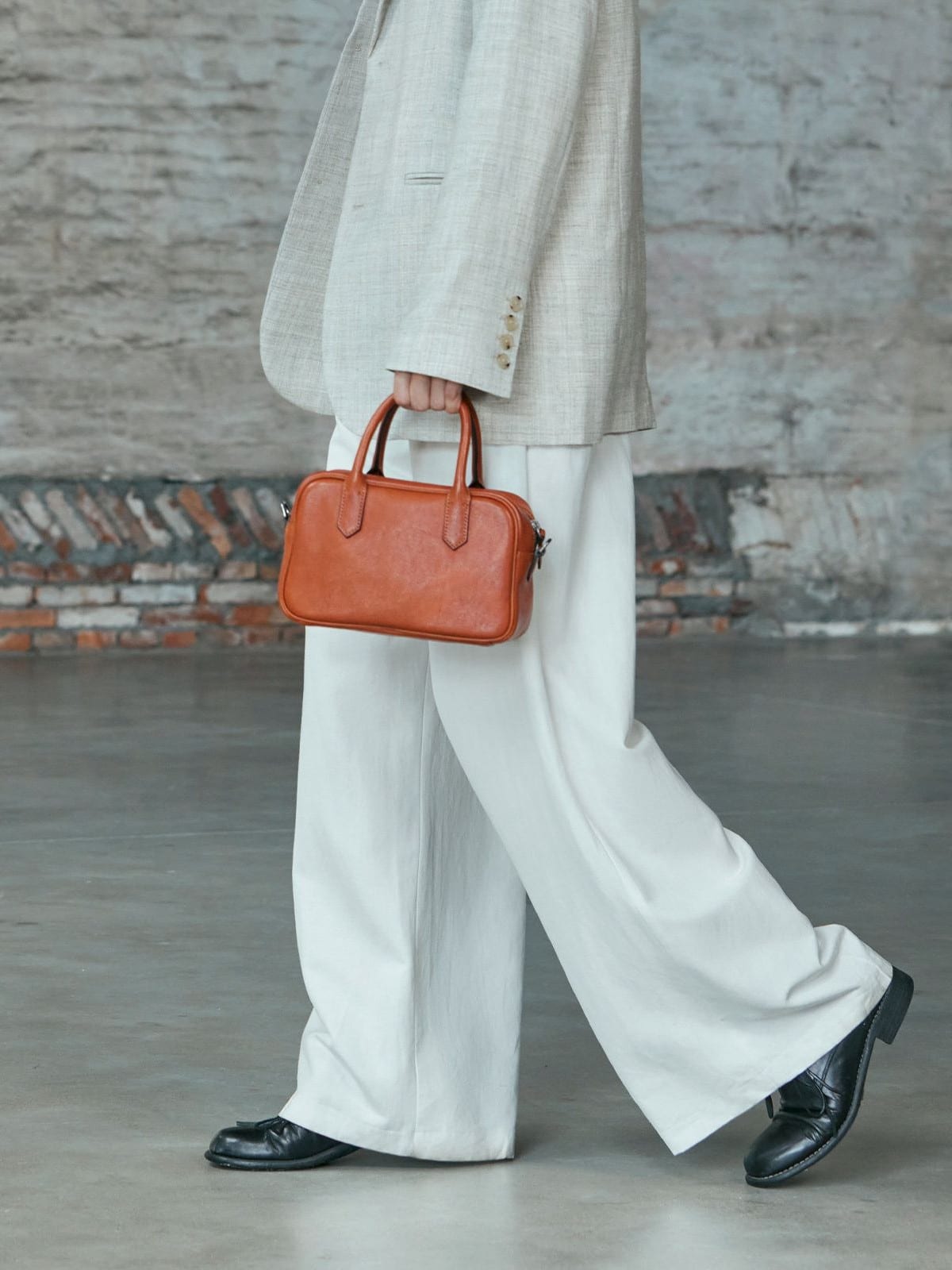 QIUZHEN Vegetable Tanned Leather Bowling Bag in Gray - On Model
