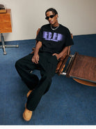 MEDM Glitch Logo Graphic Cotton T Shirt in Purple - On Male Model