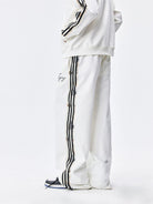 MEDM Lace Paneled Striped Track Pants in White - On Model