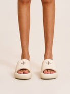 SMFK Cowhide Leather Cross Hardware Slides in Cream - On Female Model