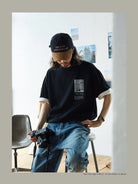 USAGE Air Spun Cotton Graphic T Shirt in Black - On Male Model