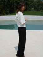 TEASEL Cooling Wide Leg Trousers in Black - On Female Model