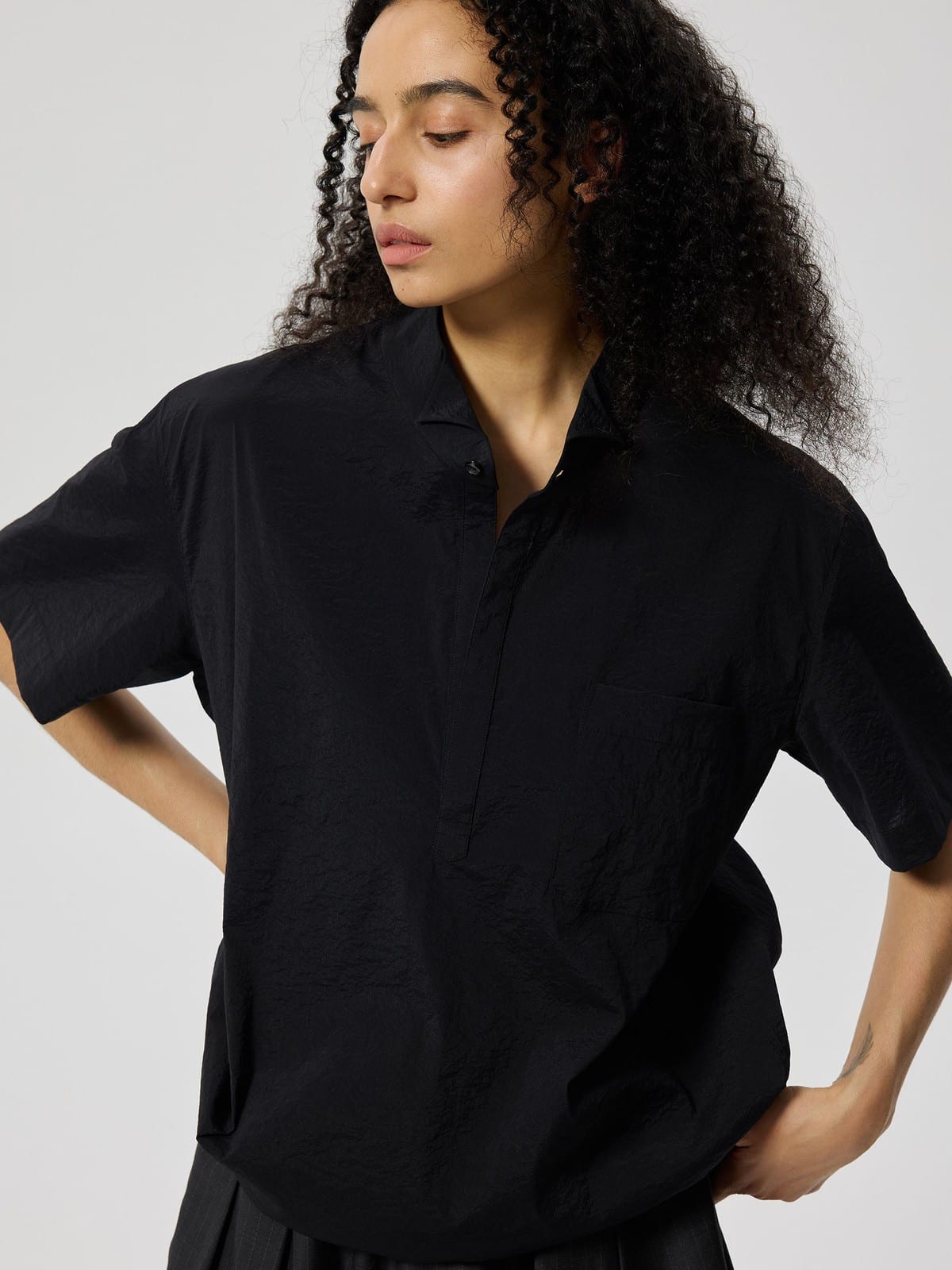 SIMPLE PROJECT Nylon Half Placket Short Sleeve Shirt in Black - On Female Model