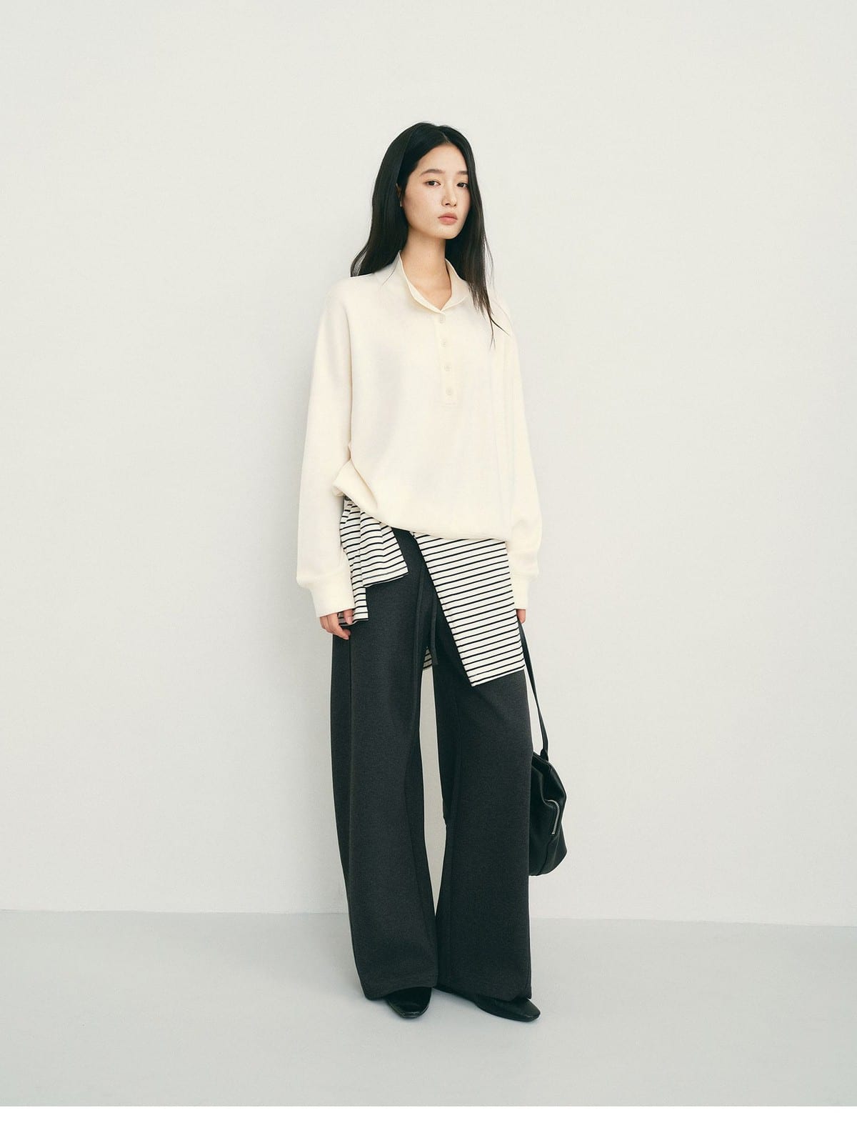 TEASEL Worsted Wool Henley Sweatshirt in Cream - On Female Model