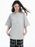 LOSTCTRL Cross Stitch Letter T Shirt in Gray - On Female Model
